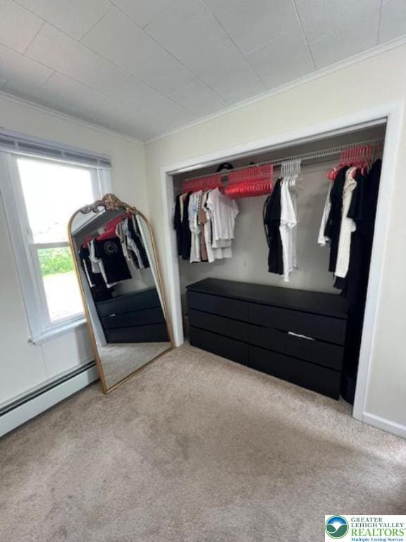 416 White St, Bowmanstown Borough, PA 18071 - unfurnished bedroom featuring carpet flooring, ornamental molding, a baseboard heating unit, and a closet