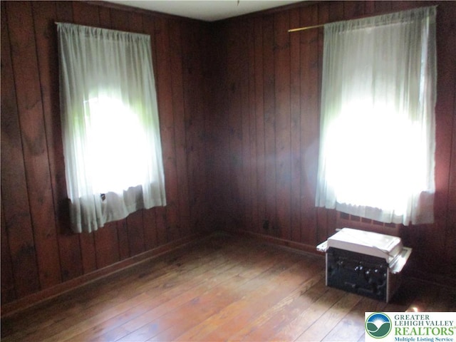 244 High St, Tatamy Borough, PA 18085 - empty room featuring wood-type flooring and wooden walls
