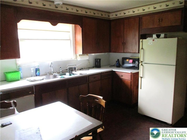 244 High St, Tatamy Borough, PA 18085 - kitchen with freestanding refrigerator, black microwave, light countertops, a sink, and dishwasher