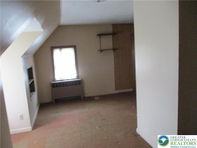 244 High St, Tatamy Borough, PA 18085 - bonus room with radiator, vaulted ceiling, and baseboards