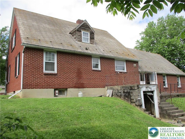 244 High St, Tatamy Borough, PA 18085 - view of property exterior with a yard and brick siding