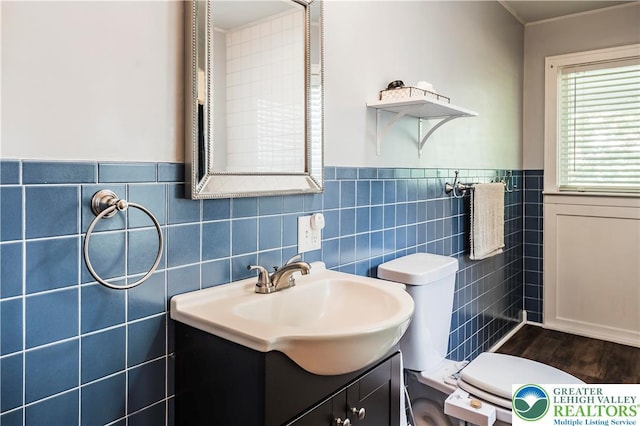 631 Main St, Tatamy Borough, PA 18085 - bathroom with vanity, toilet, tile walls, and a wainscoted wall