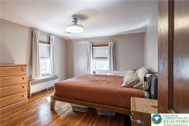 631 Main St, Tatamy Borough, PA 18085 - bedroom with radiator heating unit and hardwood / wood-style flooring