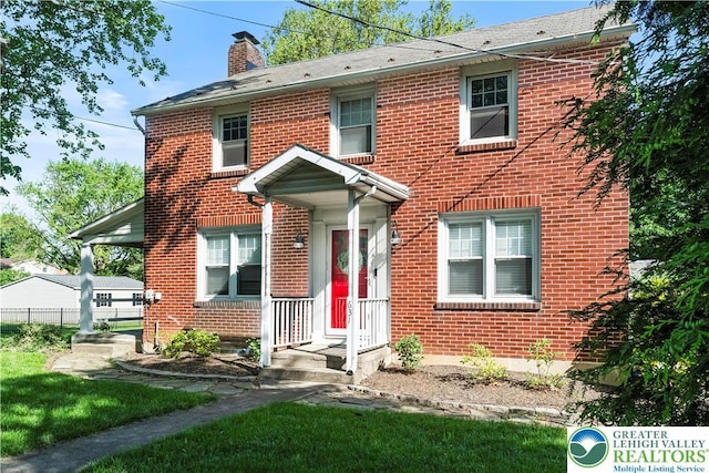 631 Main St, Tatamy Borough, PA 18085 - view of front of property with brick siding and a chimney