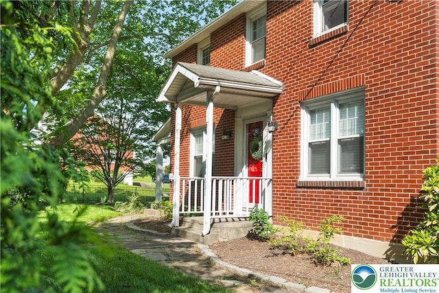 631 Main St, Tatamy Borough, PA 18085 - doorway to property featuring brick siding