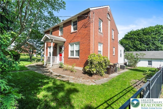 631 Main St, Tatamy Borough, PA 18085 - view of front of home featuring brick siding and central air condition unit