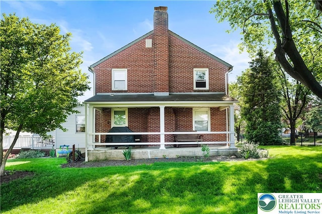 631 Main St, Tatamy Borough, PA 18085 - back of property featuring brick siding and a chimney