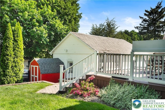 631 Main St, Tatamy Borough, PA 18085 - back of house with a wooden deck, a yard, and roof with shingles