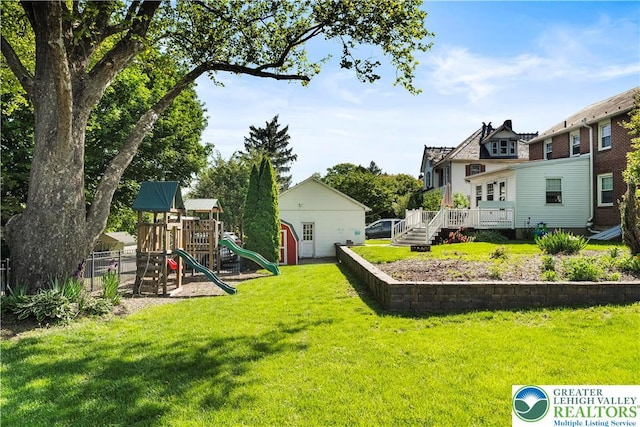 631 Main St, Tatamy Borough, PA 18085 - view of green lawn featuring a playground and a deck