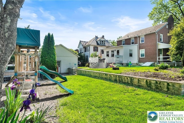 631 Main St, Tatamy Borough, PA 18085 - view of green lawn with a playground, a wooden deck, and a residential view
