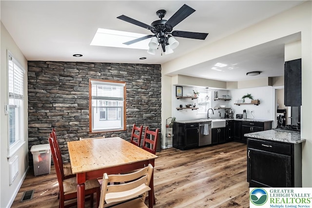 631 Main St, Tatamy Borough, PA 18085 - dining area featuring a skylight, light wood-type flooring, and ceiling fan