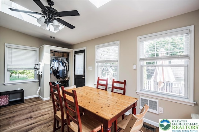 631 Main St, Tatamy Borough, PA 18085 - dining space with wood finished floors, baseboards, a wall mounted air conditioner, and a ceiling fan