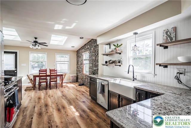 631 Main St, Tatamy Borough, PA 18085 - kitchen featuring open shelves, a skylight, appliances with stainless steel finishes, a sink, and vaulted ceiling