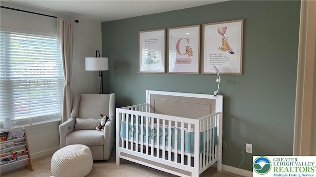 331 Minor St, Emmaus Borough, PA 18049 - carpeted bedroom with a crib, multiple windows, and baseboards