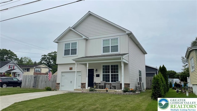 331 Minor St, Emmaus Borough, PA 18049 - view of front of home with covered porch, concrete driveway, a garage, and central AC unit
