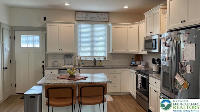 331 Minor St, Emmaus Borough, PA 18049 - kitchen with stainless steel appliances, a sink, white cabinets, and recessed lighting