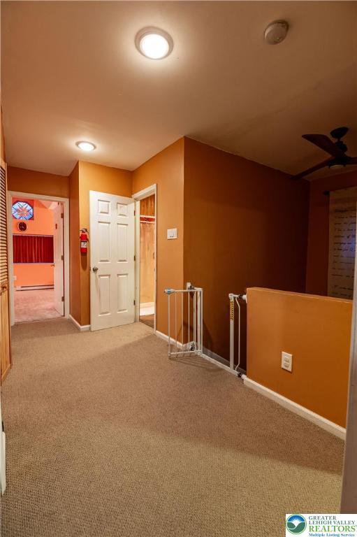 2107 3rd St, Bethlehem Twp, PA 18020 - carpeted spare room featuring a smoke detector, baseboards, and a baseboard radiator