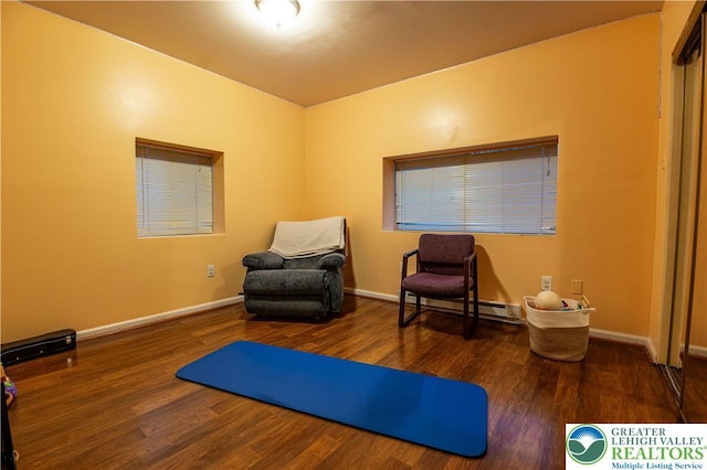 2107 3rd St, Bethlehem Twp, PA 18020 - living area featuring wood finished floors, baseboards, and baseboard heating