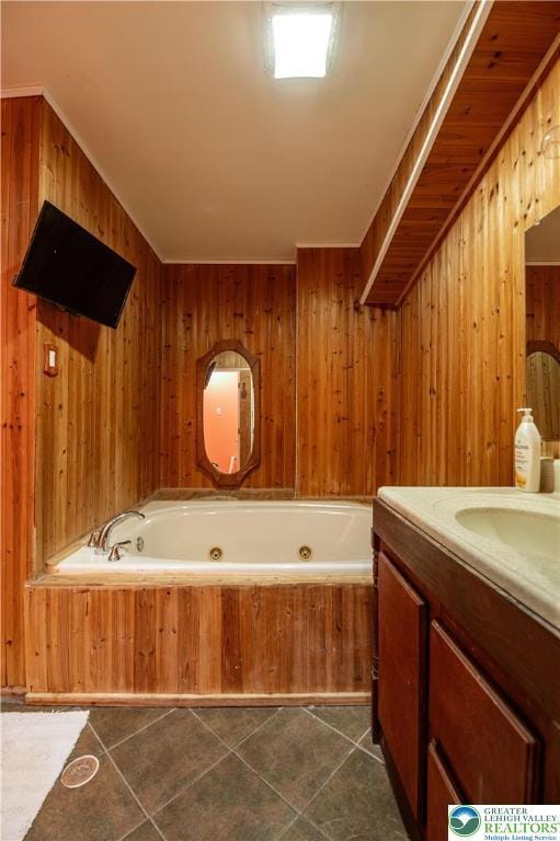 2107 3rd St, Bethlehem Twp, PA 18020 - full bathroom featuring a tub with jets, vanity, wooden walls, and tile patterned flooring
