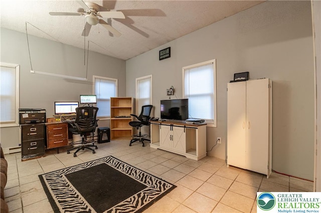 2107 3rd St, Bethlehem Twp, PA 18020 - home office featuring light tile patterned floors, healthy amount of natural light, a ceiling fan, and a textured ceiling