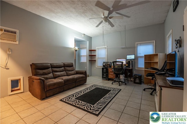 2107 3rd St, Bethlehem Twp, PA 18020 - home office featuring a ceiling fan, light tile patterned floors, a wall mounted air conditioner, a textured ceiling, and plenty of natural light