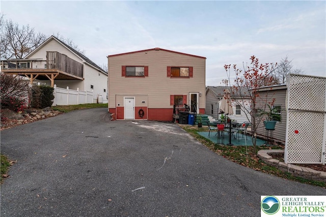 2107 3rd St, Bethlehem Twp, PA 18020 - back of house featuring asphalt driveway and a patio