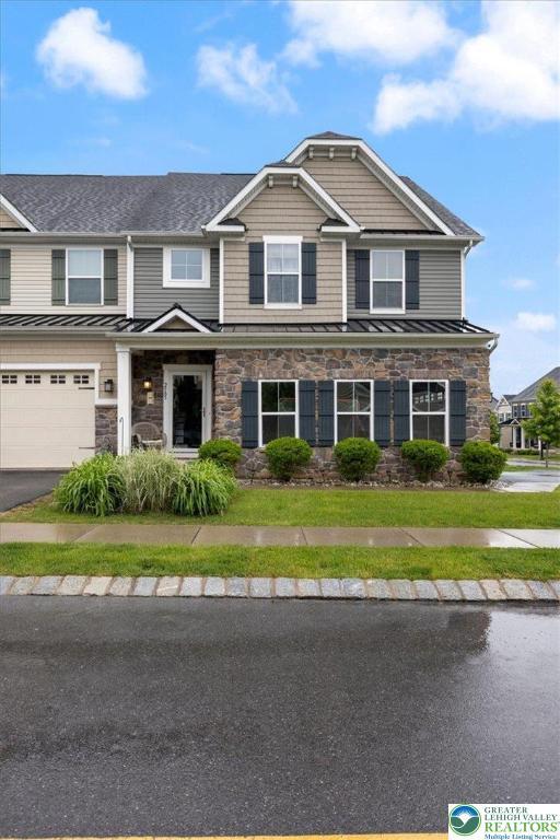 2585 Raya Way, Bethlehem Twp, PA 18045 - view of front of property with a standing seam roof, stone siding, and metal roof