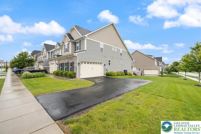 2585 Raya Way, Bethlehem Twp, PA 18045 - view of home's exterior with driveway, a garage, a yard, a residential view, and brick siding