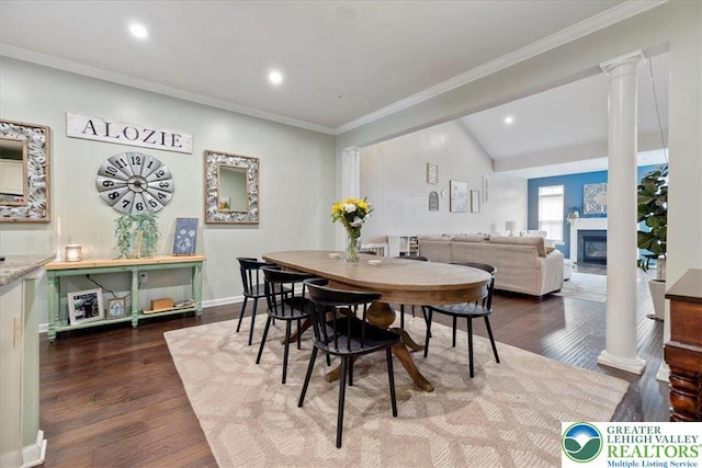 2585 Raya Way, Bethlehem Twp, PA 18045 - dining space featuring ornate columns, dark wood-style floors, a glass covered fireplace, recessed lighting, and baseboards