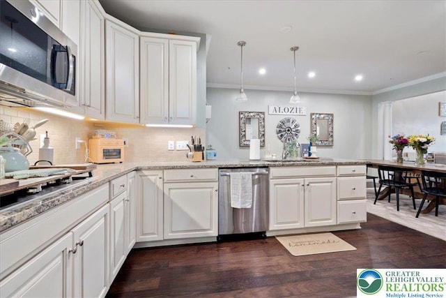 2585 Raya Way, Bethlehem Twp, PA 18045 - kitchen with stainless steel appliances, a sink, a peninsula, white cabinetry, and backsplash