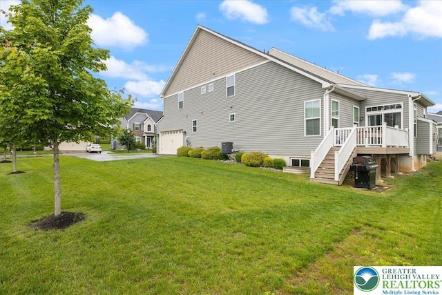 2585 Raya Way, Bethlehem Twp, PA 18045 - view of home's exterior featuring a garage, stairs, a deck, driveway, and a yard