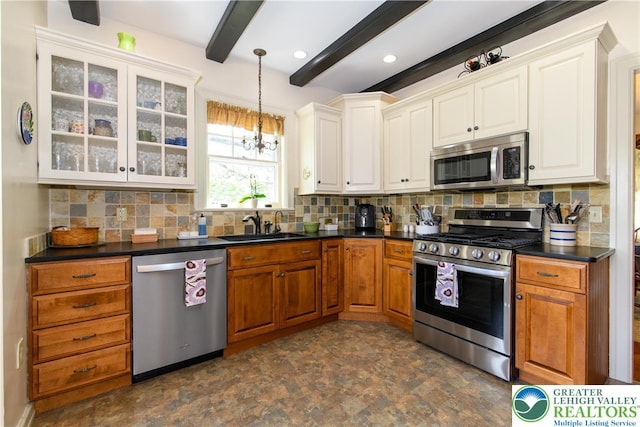 215 S 22nd St, Allentown City, PA 18104 - kitchen with appliances with stainless steel finishes, a sink, a chandelier, beam ceiling, and dark countertops
