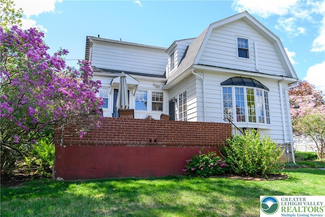 215 S 22nd St, Allentown City, PA 18104 - view of front facade featuring a front lawn and a gambrel roof