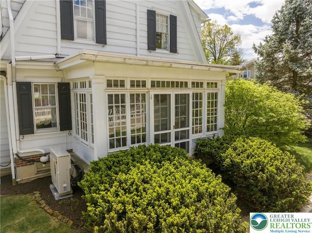 215 S 22nd St, Allentown City, PA 18104 - view of side of home featuring a cooling unit and a sunroom