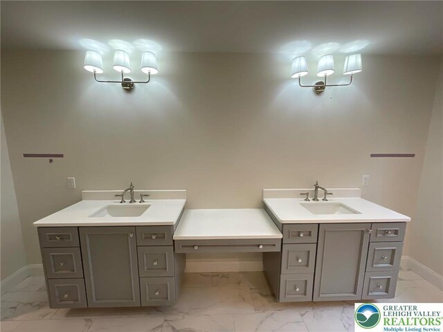 Blue Barn Rd Unit 1456, Upper Macungie Twp, PA 18104 - bathroom featuring marble look tiles, vanity, and baseboards