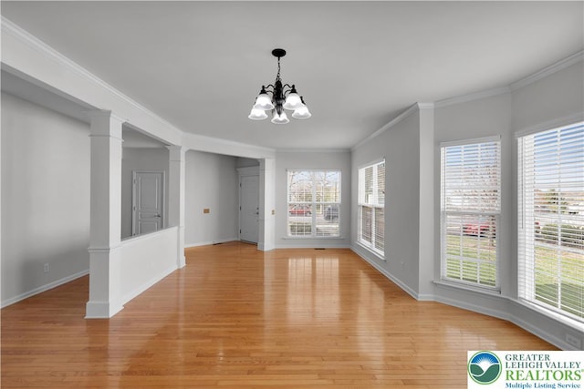 8604 Cascade Rd, Upper Macungie Twp, PA 18031 - unfurnished dining area with a chandelier, light wood-style flooring, plenty of natural light, baseboards, and crown molding