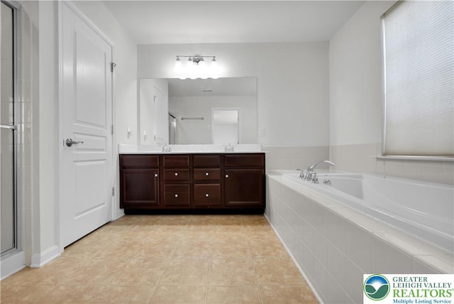 8604 Cascade Rd, Upper Macungie Twp, PA 18031 - bathroom with double vanity, a garden tub, a shower with shower door, and tile patterned flooring