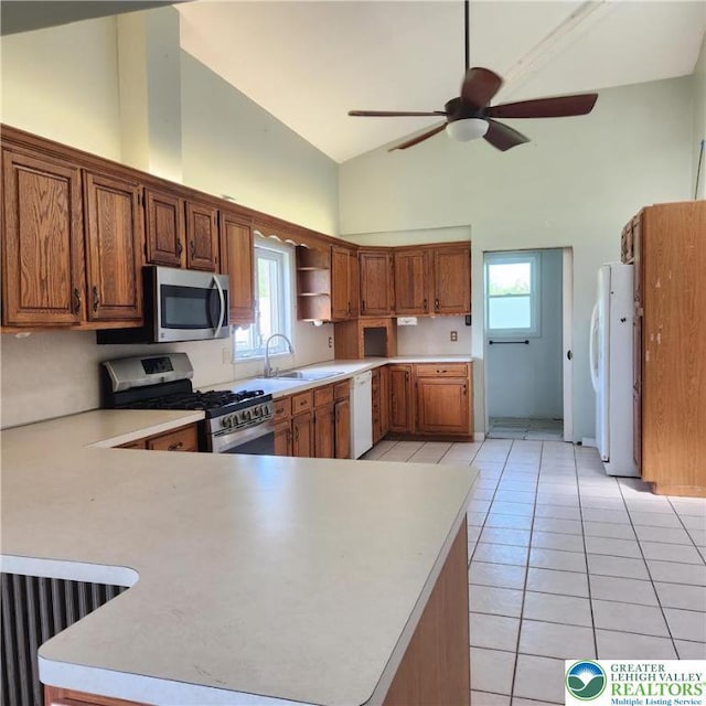 2357 Spring St, North Whitehall Twp, PA 18037 - kitchen with appliances with stainless steel finishes, high vaulted ceiling, ceiling fan, a peninsula, and light countertops