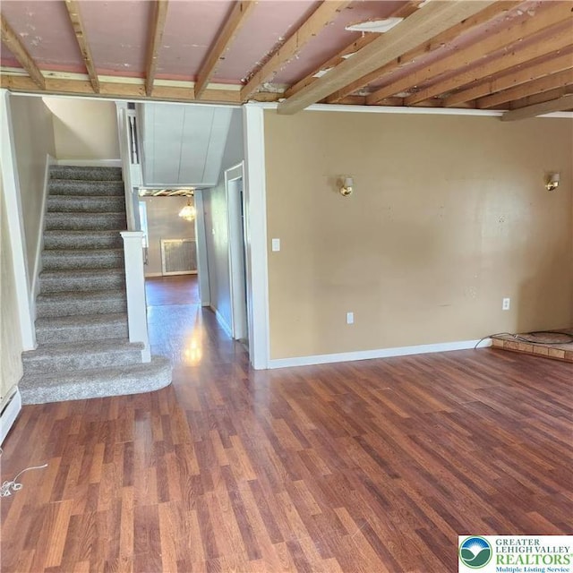 2357 Spring St, North Whitehall Twp, PA 18037 - unfurnished living room with wood finished floors, stairway, and baseboards