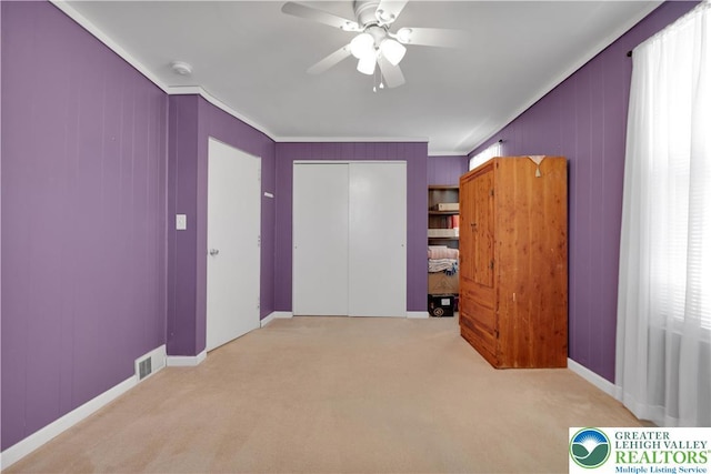 622 Scholl Ave, Salisbury Twp, PA 18015 - unfurnished bedroom with ornamental molding, carpet floors, a closet, and ceiling fan