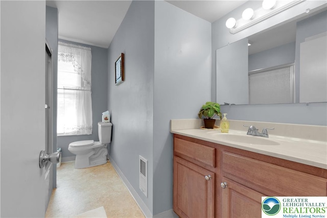622 Scholl Ave, Salisbury Twp, PA 18015 - full bathroom featuring toilet, vanity, plenty of natural light, and baseboards