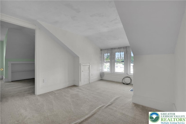 622 Scholl Ave, Salisbury Twp, PA 18015 - bonus room with carpet floors, lofted ceiling, and baseboards