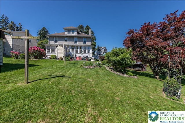622 Scholl Ave, Salisbury Twp, PA 18015 - rear view of house with a lawn