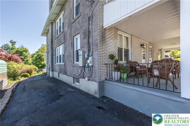 622 Scholl Ave, Salisbury Twp, PA 18015 - view of home's exterior featuring brick siding and covered porch