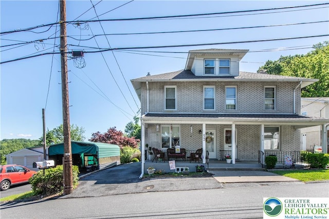 622 Scholl Ave, Salisbury Twp, PA 18015 - traditional style home with covered porch, brick siding, and asphalt driveway