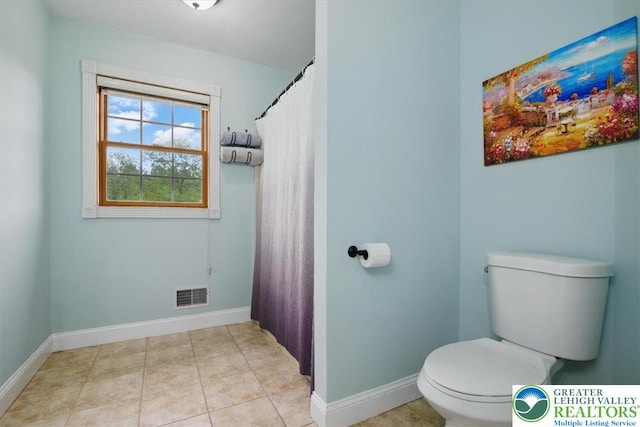 2740 Olive Branch Ln, Moore Twp, PA 18014 - bathroom with toilet, baseboards, a shower with shower curtain, and tile patterned flooring