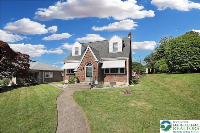 613 S Hoffert St, Fountain Hill Boro, PA 18015 - view of front facade with brick siding, a front lawn, a chimney, and a shingled roof