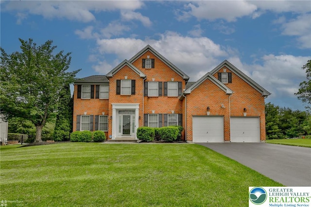 1303 Foxview Dr, Hanover Twp, PA 18017 - view of front of home featuring brick siding, driveway, and a front yard