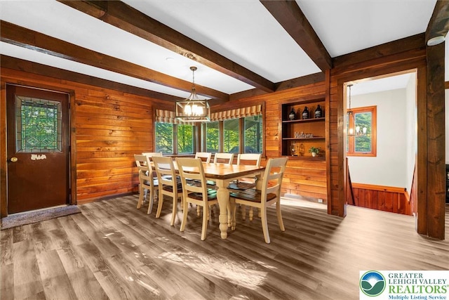 160 Camelback Rd, Pocono Twp, PA 18372 - dining room featuring wood walls, a chandelier, beamed ceiling, and wood finished floors