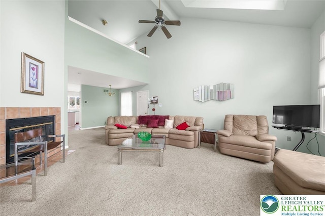 275 Ridings Cir, Macungie Boro, PA 18062 - living room with high vaulted ceiling, carpet flooring, a ceiling fan, and a tile fireplace